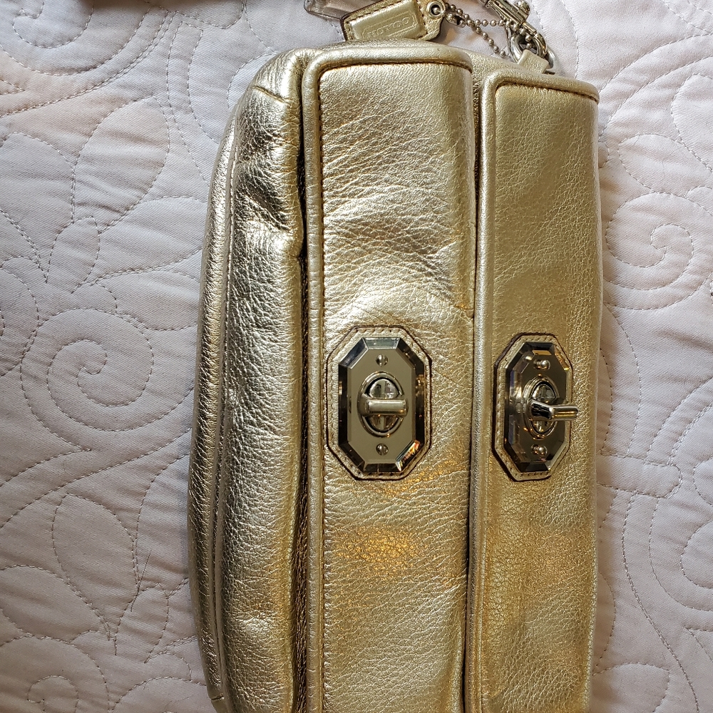 Coach metallic gold double turnlock clutch/wristle